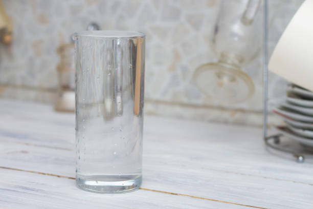 istock A glass full of clear water sits on the kitchen table. Copy space 1319790494