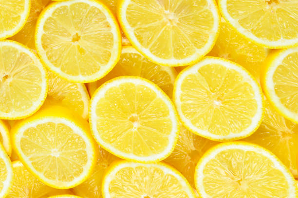 istock A slices of fresh juicy yellow lemons.  Texture background, pattern. 1319794442