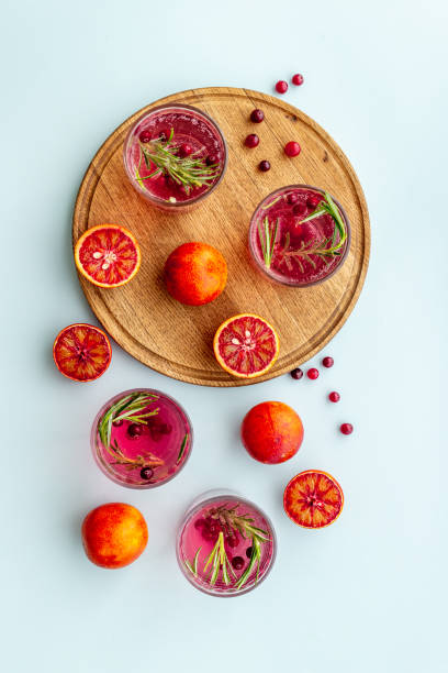istock Glasses of refreshing lemonade with cranberries and red oranges 1319794473