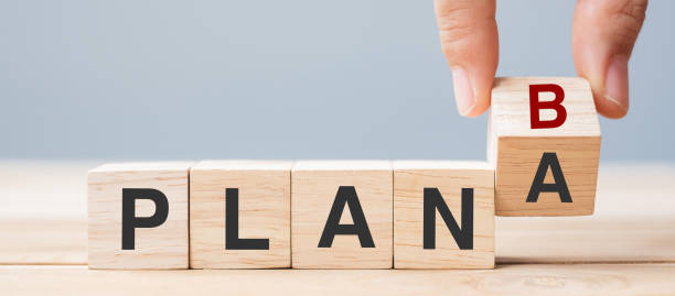 istock Businessman hand flipping wooden cube blocks with PLAN A change to PLAN B text on table background. strategy, leadership, management, marketing, project and Crisis concepts 1319794712