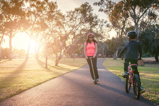 istock Mother with her son riding riding in the park 1319798573