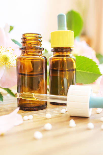 istock rosehip extract in bottles. Homeopathy. Selective focus. 1319799078
