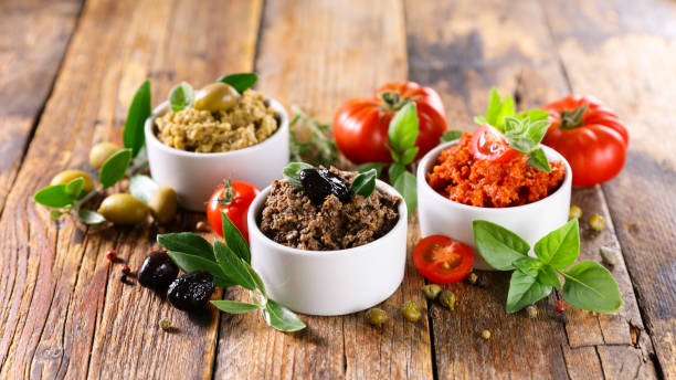 istock assorted of tapenade- black and green olive and tomato 1319800454
