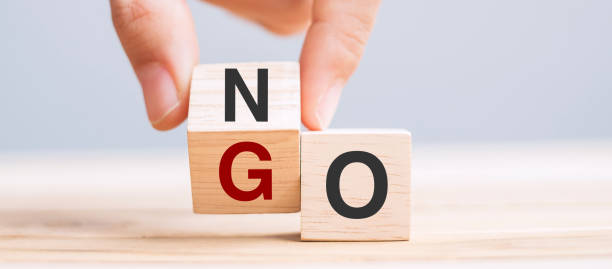 istock hand change wooden cube block between No and Go 1319802383