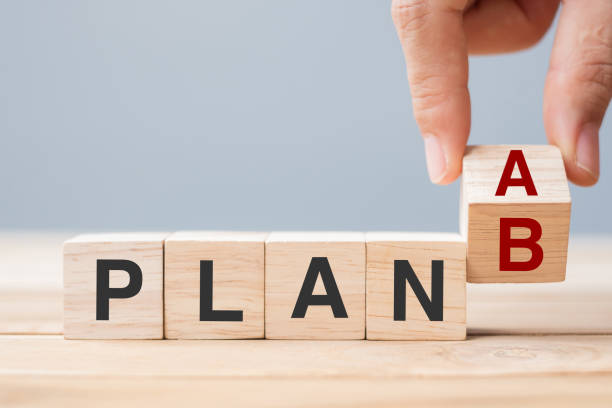 istock Businessman hand flipping wooden cube blocks with PLAN A change to PLAN B text on table background. strategy, leadership, management, marketing, project and Crisis concepts 1319802413