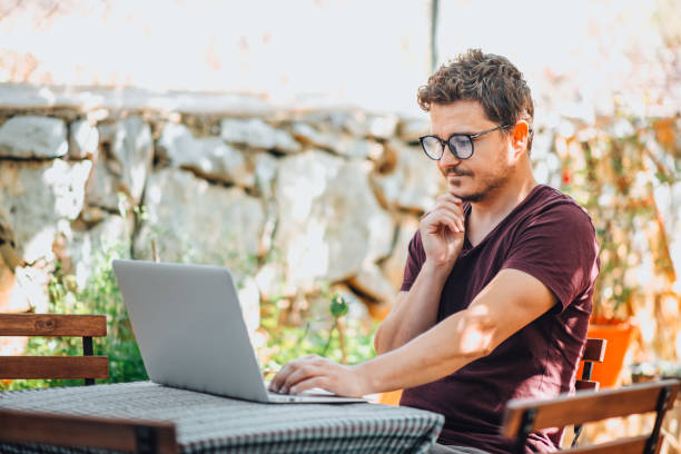 istock Man Working Freelance From His Garden 1319802824