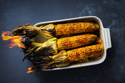 Grilled corn on the cob served in a baking tray