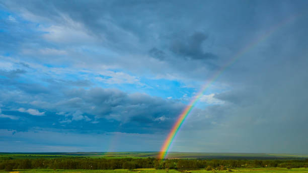 istock The Rainbow over Rural Landscape after Thunderstorm. 1319805910