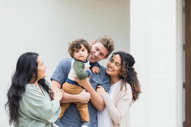 istock Multi-generation family smiles and laughs together 1319813808