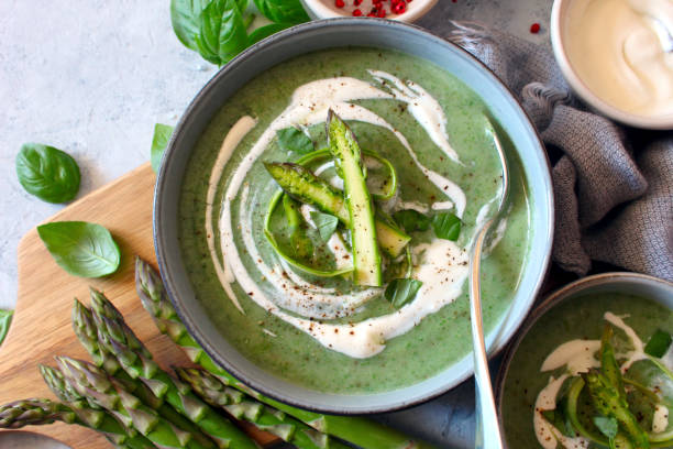 Asparagus and potatoes cream soup. Green soup. stock photo