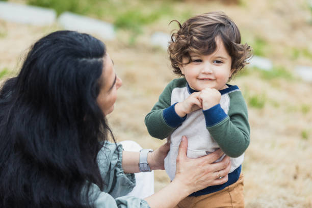 istock Adorable little boy playing with his grandma 1319813986