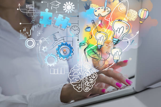istock Woman hands with laptop and colourful brain sketch 1319817810
