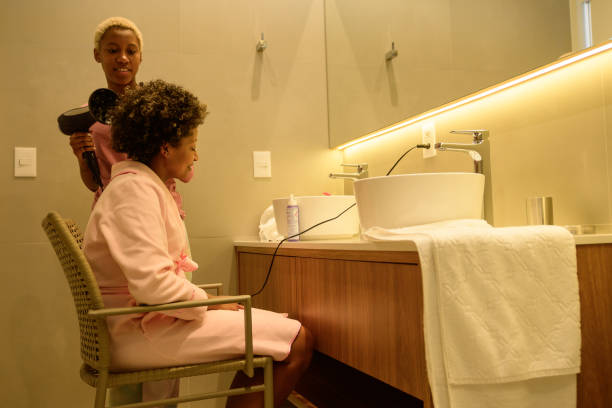 istock A black daughter drying her mother's hair 1319819287