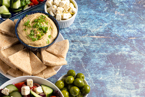 istock Fresh Greek Food on a Rustic Blue Wooden Background 1319820183