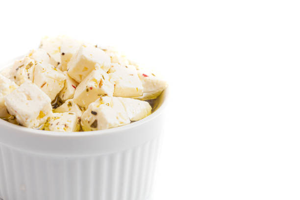 Bowl Filled with Cubed Feta Cheese Isolated on a White Background