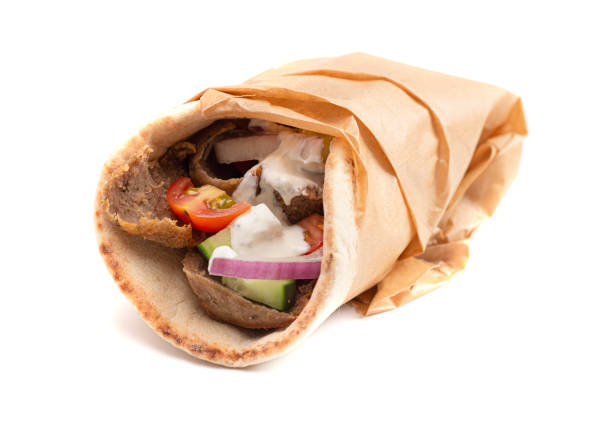 istock Gyro with Vegetables and Garlic White Sauce on a White Background 1319820363