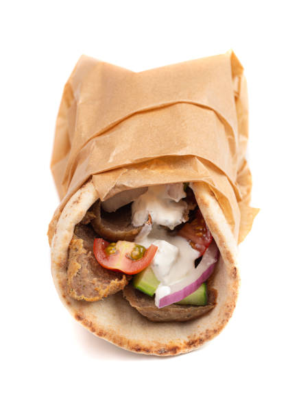 istock Gyro with Vegetables and Garlic White Sauce on a White Background 1319820379