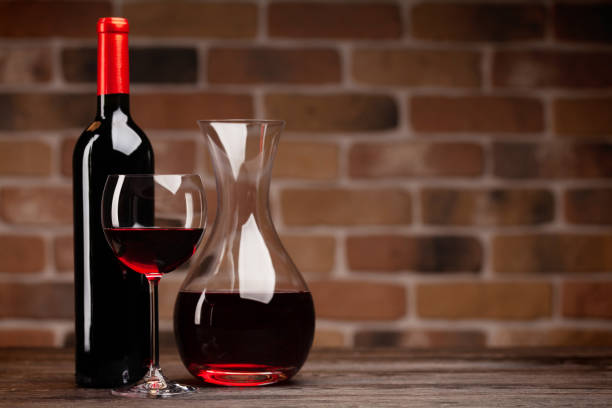 istock Wine decanter, bottle, glass of red wine 1319820681