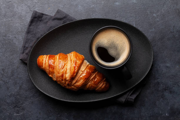 istock Espresso coffee and croissant for breakfast 1319821420