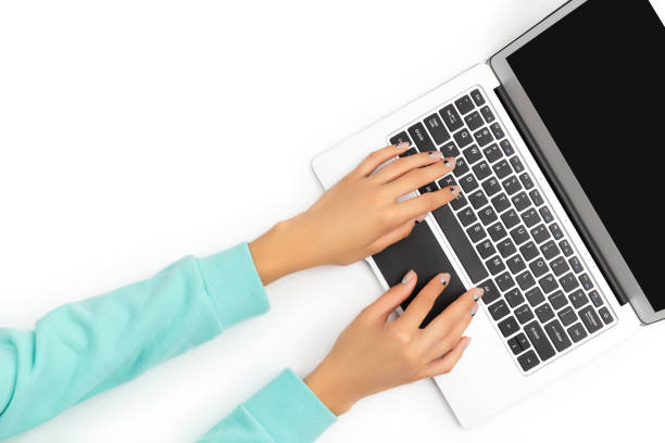 istock Female hands typing on laptop on marble background 1319828167