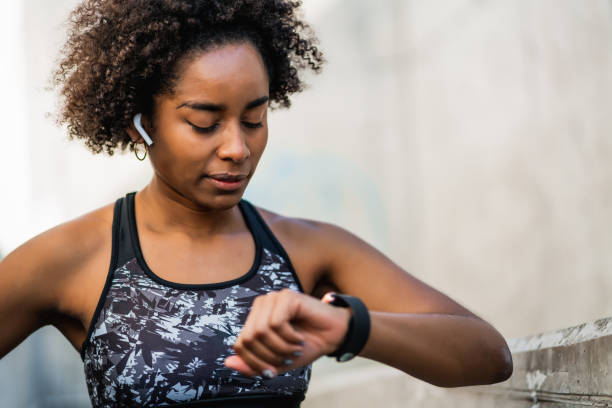 istock Fitness woman checking time on smart watch. 1319832320