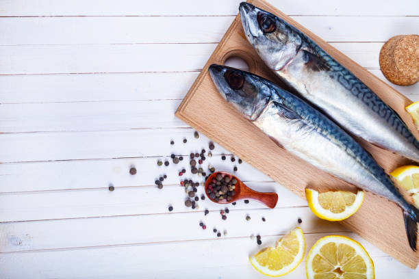istock Raw mackerel on a cutting board with spices. 1319832603