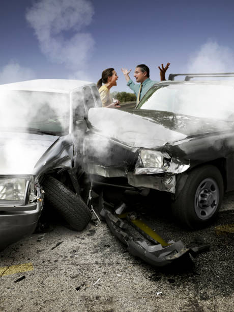 istock Two people arguing after a car accident. 1319833382