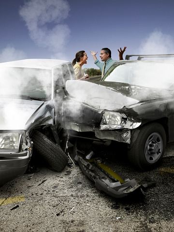 Two people arguing after a car accident.