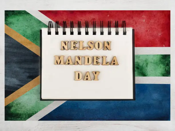 Happy Nelson Mandela Day. Beautiful greeting card. Closeup, view from above. National holiday concept. Congratulations for family, relatives, friends and colleagues