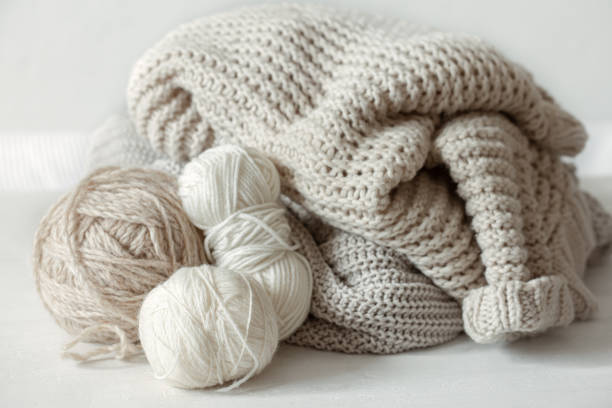 istock Cozy composition with knitted yarn in pastel colors. 1319834060