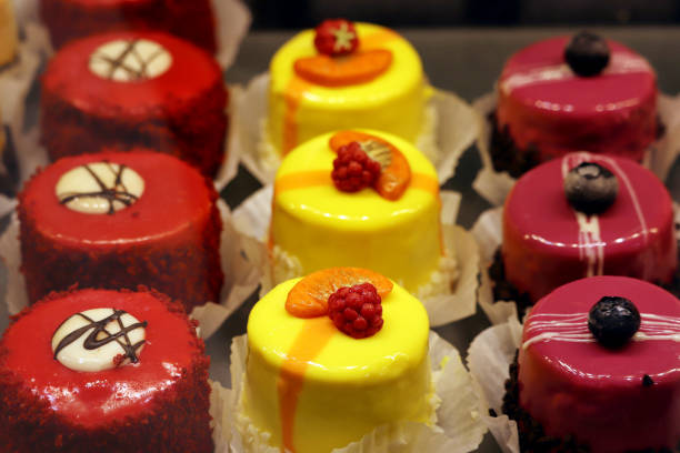 istock Creamy cakes with fresh fruits and berries 1319836239