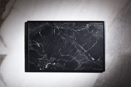 Directly above marble textured cutting board on the marble texture background