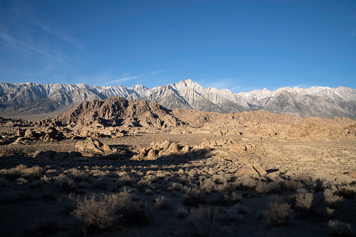 The Californian Sierra Nevada mountain range, as seen from Alabama Hills, California.  Mt Whitney is in the far background.