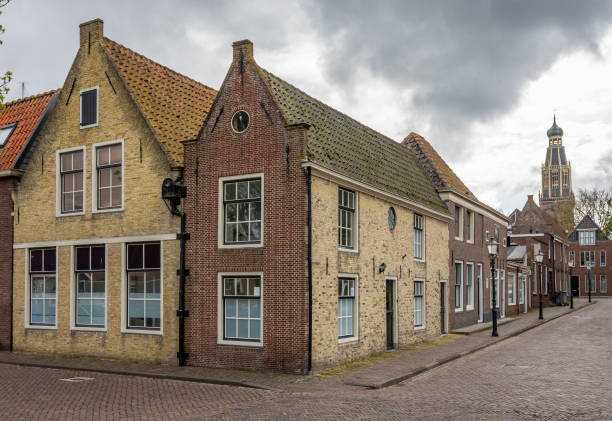 Historical buildings in dutch city Enkhuizen with tower of Zuiderkerk church Enkhuizen is a municipality and a city in the Netherlands, in the province of North Holland and the region of West-Frisia. enkhuizen stock pictures, royalty-free photos & images