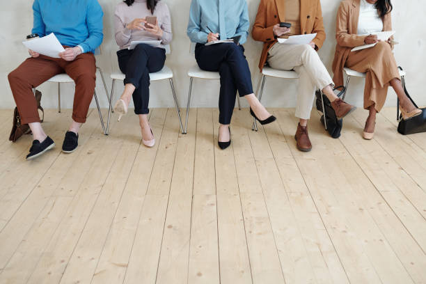 istock Legs of people in line 1319840302