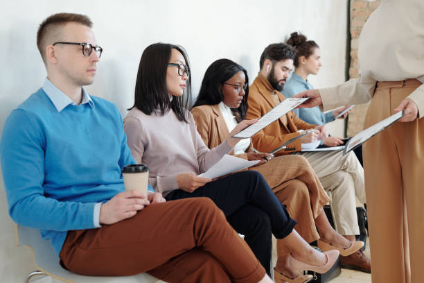 istock Giving questionnaire to job applicants 1319840319