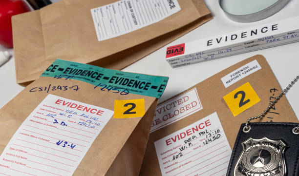 istock Files and evidence bag in a crime lab, conceptual image 1319842677