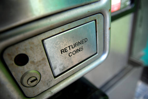 Telephone returned coins slot.