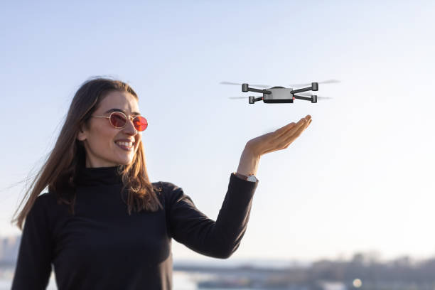 istock small drone landing on palm 1319844279