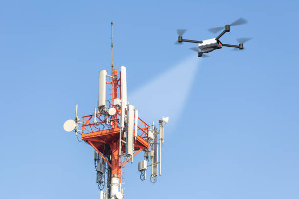 drone checking mobile network tower stock photo