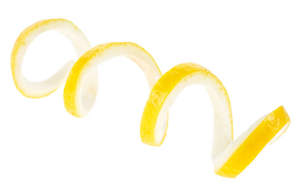 istock Lemon fruit as cocktail ingredient, selective focus. Lemon zest isolated on a white background. 1319844546
