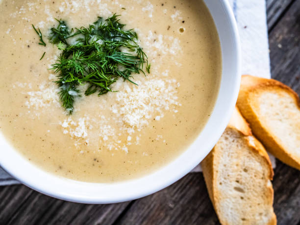 istock Cream cheese garlic soup on wooden table 1319847428