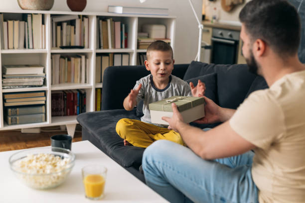 istock father and son at home 1319848853