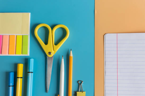 istock Stationery items. Colourful items for study and work in office on bright background. Return to school and to work after quarantine. Flatlay with copy space. Top view. schooling after the pandemic. 1319849075