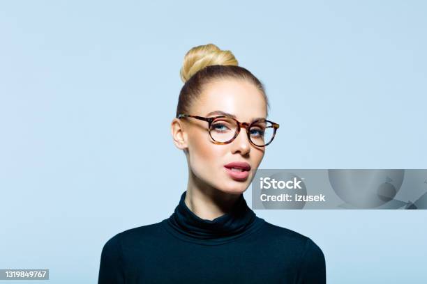 Headshot Of Confident Elegant Woman Stock Photo - Download Image Now - Eyeglasses, Fashion Model, Hair Bun