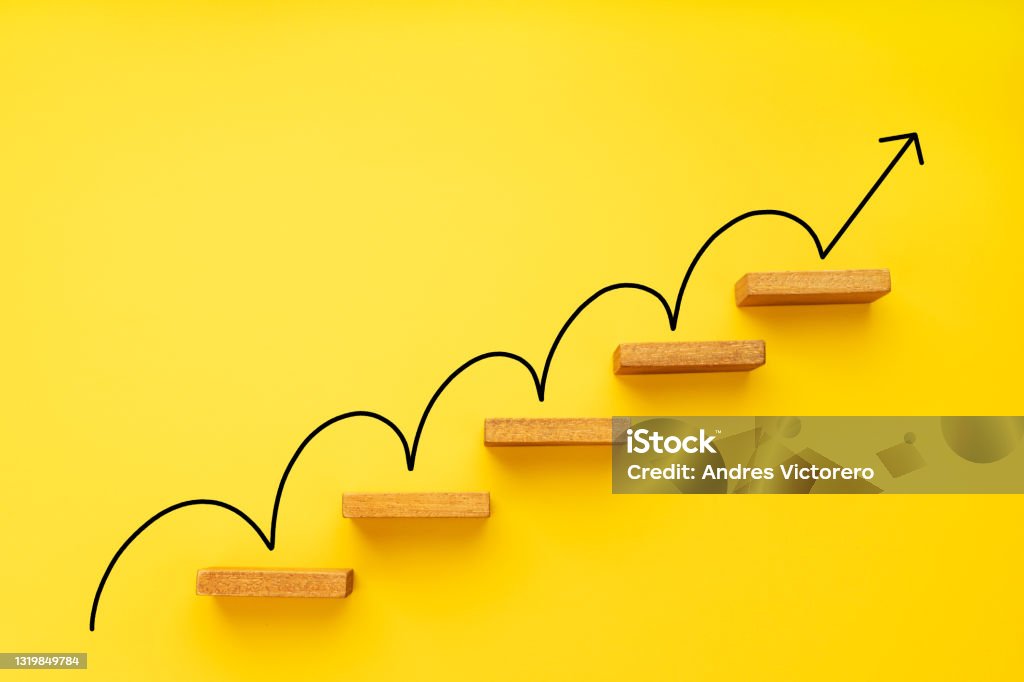 Rising arrow on staircase on yellow background Rising arrow on staircase on yellow background. Growth, increasing business, success process concept. Copy space Progress Stock Photo