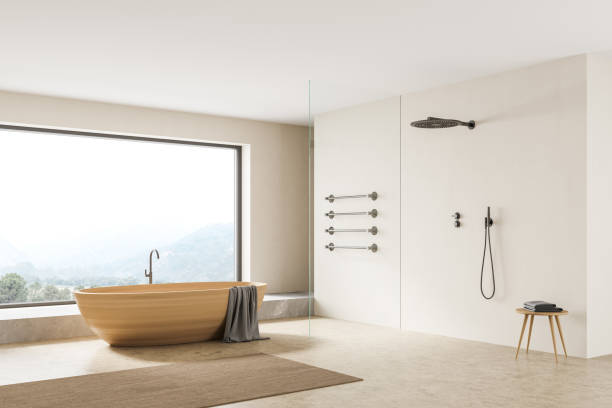 istock Beige bathroom interior with shower, bathtub on concrete floor 1319851605