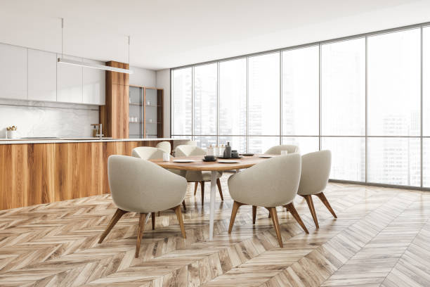 istock White wooden kitchen interior with eating table and kitchen set near window 1319852378