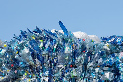 colorful plastic trash bags isolated on white background