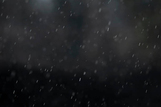 istock Raindrops in the air, natural dark background 1319854019